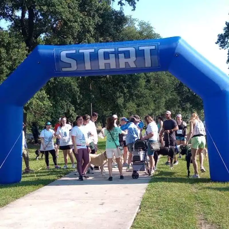 The starting line with runners lined up at the annual Houston Humane Society Fun Run held to support animal rescue efforts.