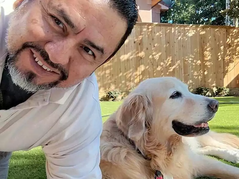 Scoop le Poop employee, Nelson, with a happy pup customer